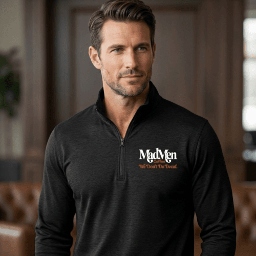 Man wearing the black MadMen Coffee premium tri-blend quarter-zip pullover